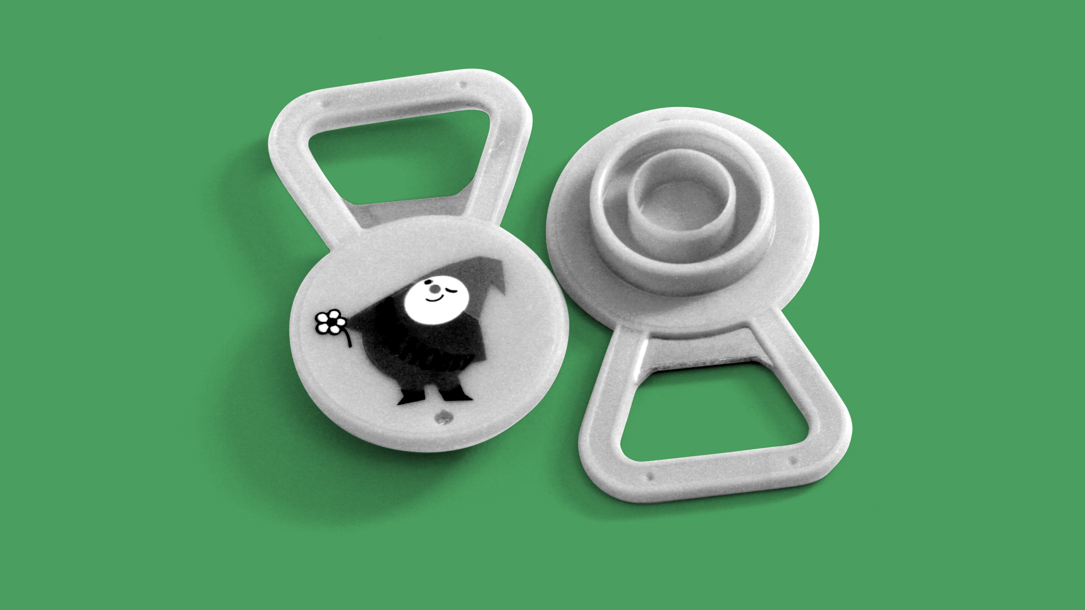 Bottle opener with the STIHL hobby gnome illustration; black and white photo.