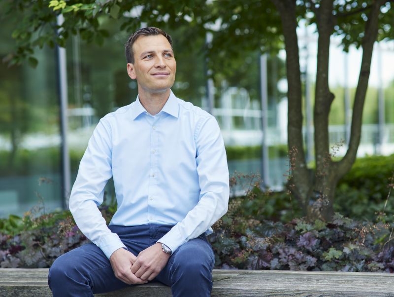 Portrait of a man sitting down.