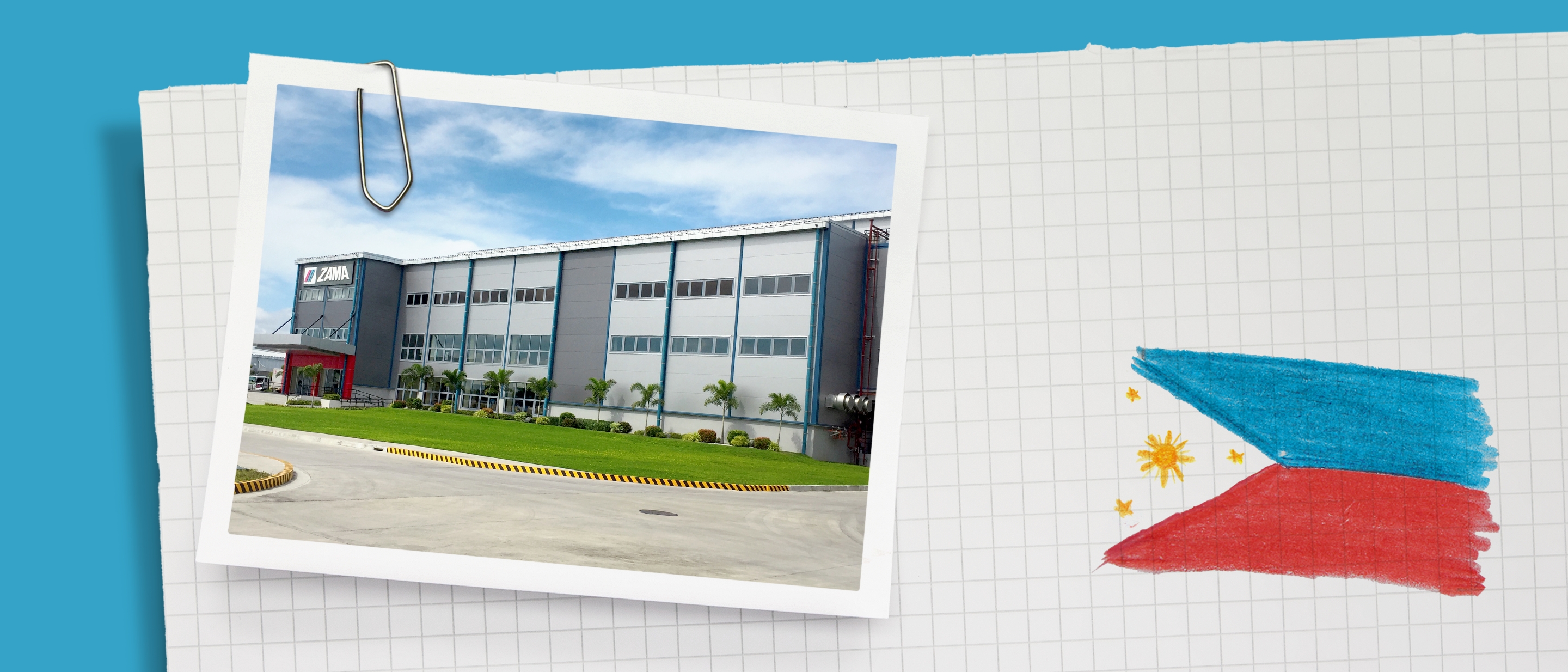 A gray building with ZAMA lettering.