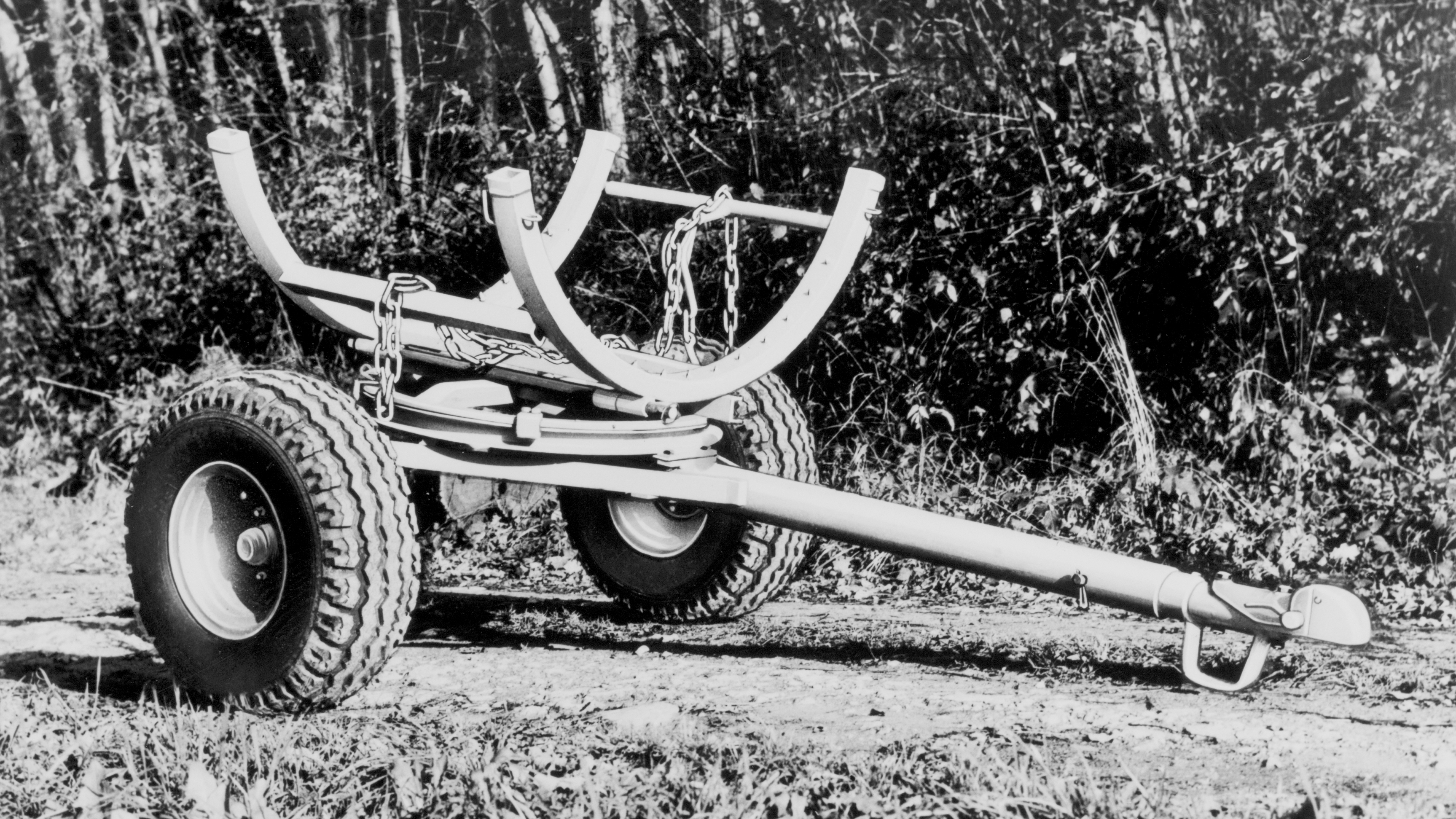 An empty forwarder by STIHL; black-and-white photo.